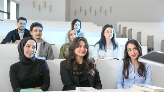 Pakistani and international students attending a class in the UK