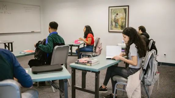 Pakistani students attending a UK classroom.