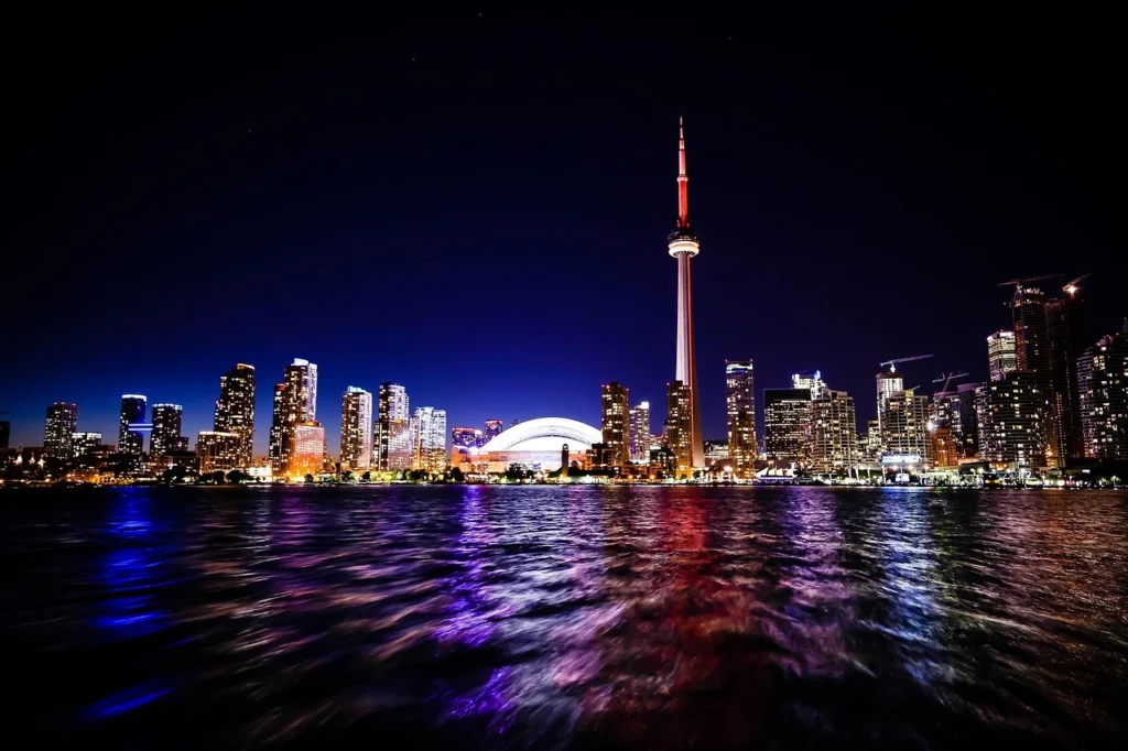 Toronto skyline at night representing Canada immigration and work permit opportunities for Pakistani applicants