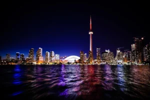 Toronto skyline at night representing Canada immigration and work permit opportunities for Pakistani applicants