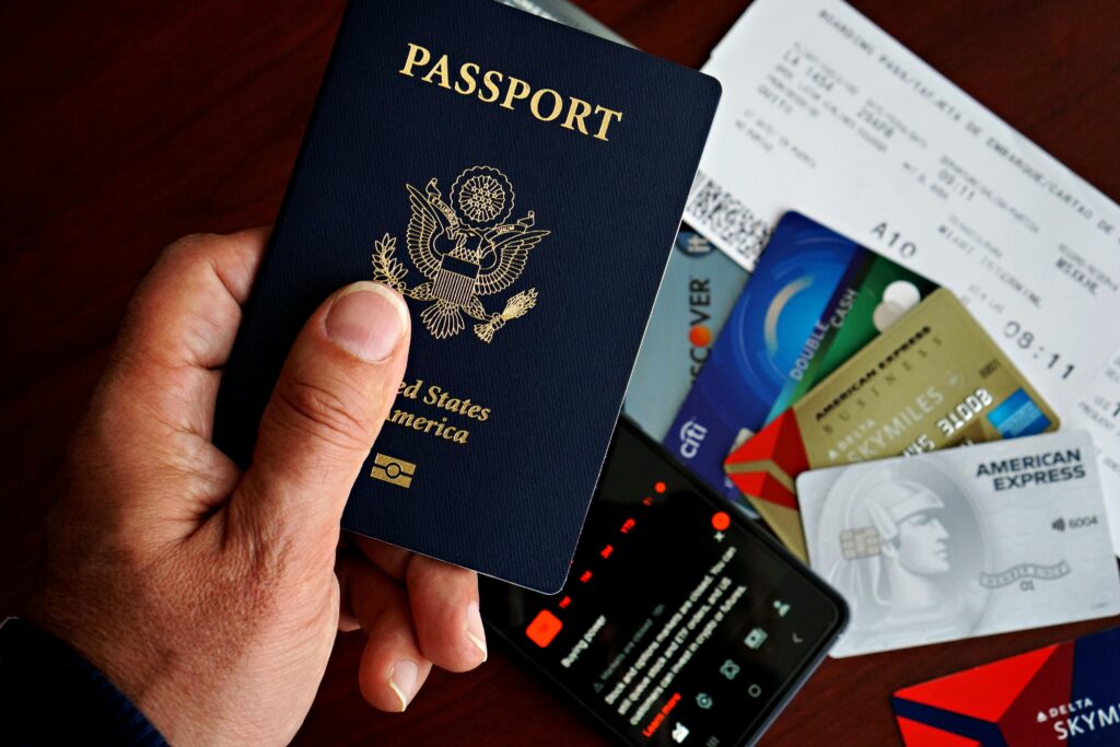 Person holding passport representing IELTS General Training for work and immigration purposes