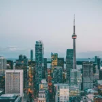 Toronto skyline with CN Tower representing Canada immigration and Express Entry opportunities for senior managers